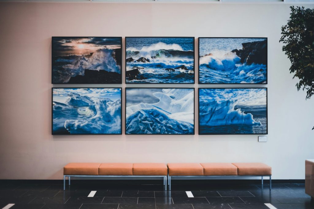 a wall with a few paintings on it